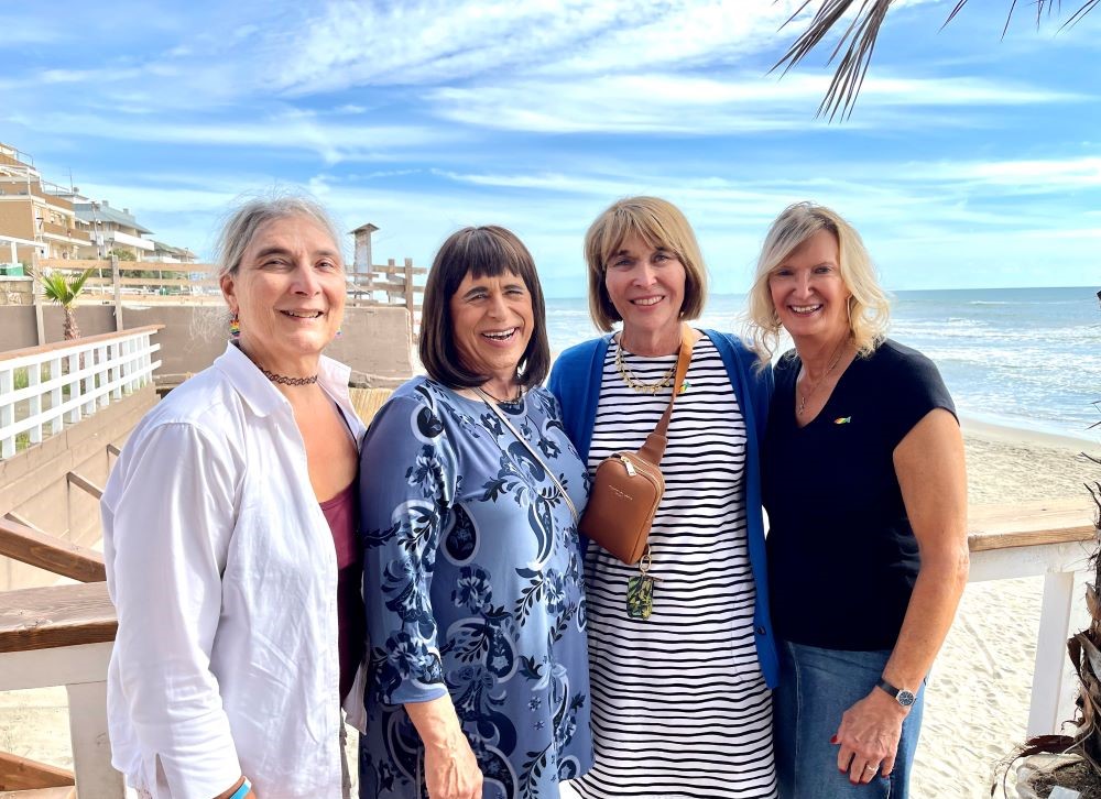 Lynn Discenza, Martha Marvel, Maureen Rasmussen and Christine Zuba pose during a break in Torvaianica, a town outside Rome, during their visit to Fr. Andrea Conocchia's parish on Sept. 16. (Camillo Barone) Lynn Discenza, Martha Marvel, Maureen Rasmussen and Christine Zuba pose during a break in Torvaianica, a town outside Rome, during their visit to Fr. Andrea Conocchia's parish on Sept. 16. (Camillo Barone)